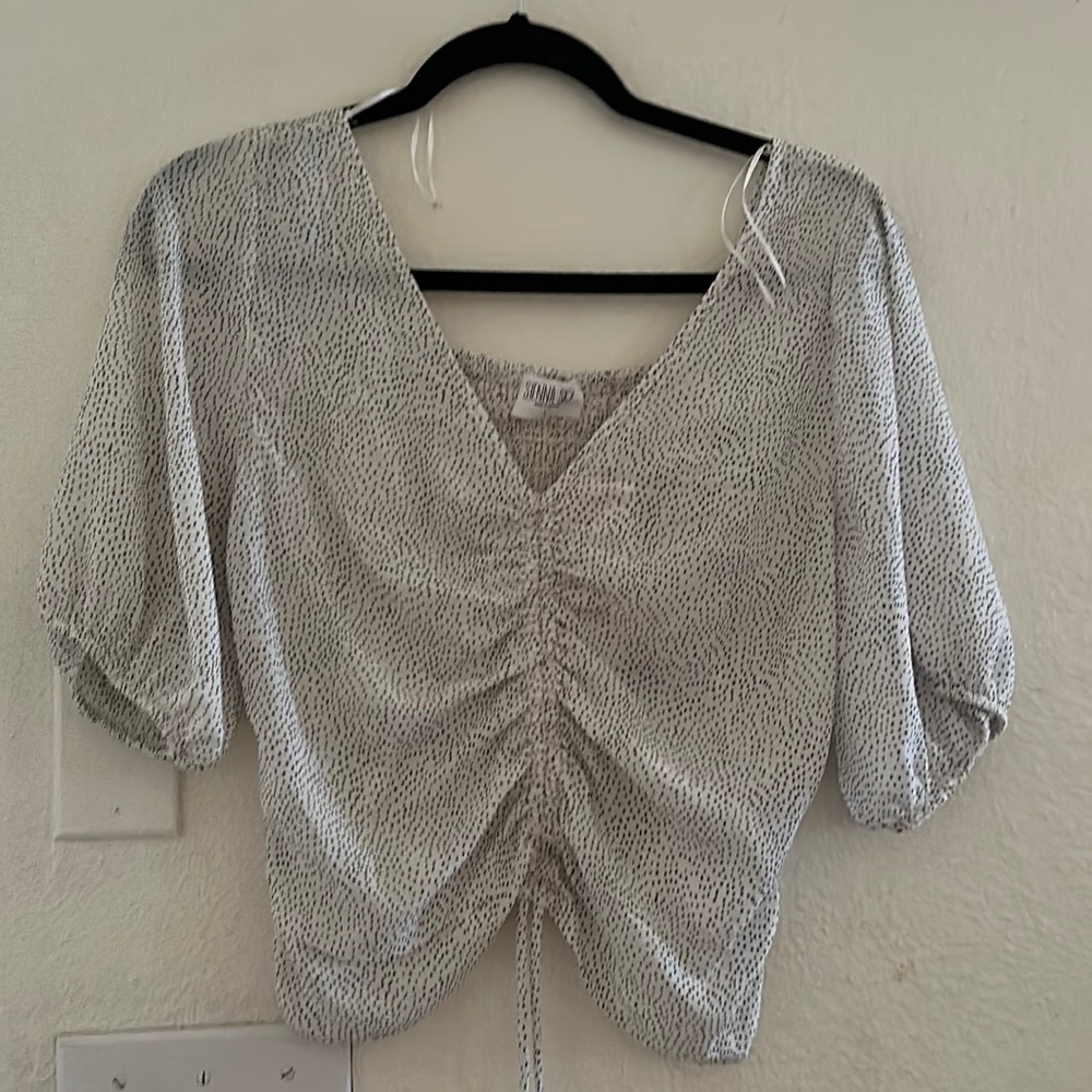 White top with black poka dots. Sienna Sky